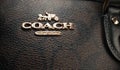 February 2024 - New Your, USA. Coach brand logo. Handbag satchel with monogram pattern in canvas. Luxury fashion Royalty Free Stock Photo