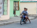 February 22, 2020 Ocoa, Dominican republic. image of three people on one motorcycle with no helmets.