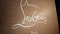 February 2024 - Paris, France. Christian Louboutin label logo. Shoes heels in brand box. Luxury fashion french company.