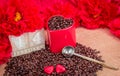 14 February rosted coffee beans with heart chocolates red flowers red mug