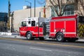 Firetruck rushing down a street in downtown San Jose