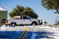 February 27, 2018 San Jose / CA / USA - Truck equipped with a plow clearing the snow from the road on top of Mt Hamilton on a