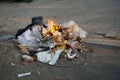 February 21st 2021 Dehradun India. Burning pile of garbage full of plastics and other harmful waste on the street