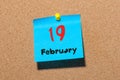 February 19th. Day 19 of month, calendar on cork notice board background. Winter time. Empty space for text Royalty Free Stock Photo