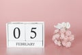 February 05th. Day 5 of month. Calendar cube on modern pink background, concept of bussines and an importent event