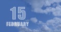 february 15. 15-th day of the month, calendar date.White numbers against a blue sky with clouds. Copy space, winter Royalty Free Stock Photo