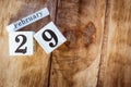 February 29th. Day 29 of February month, white calendar blocks on vintage wooden table background. Winter time. Empty space for