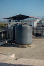 february 12th 2022, Dehradun City India. Big plastic water tanks on a roof top of a building in Urban area Royalty Free Stock Photo