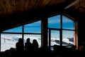 February 10th 2019 - Naoussa, Greece - The silhouettes of three young ladies in the cosy atmosphere in the chalet of 3-5 Pigadia s