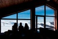 February 10th 2019 - Naoussa, Greece - The silhouettes of three young ladies in the cosy atmosphere in the chalet of 3-5 Pigadia s