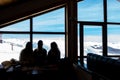 February 10th 2019 - Naoussa, Greece - The silhouettes of three young ladies in the cosy atmosphere in the chalet of 3-5 Pigadia s