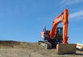 2017 February 19. Tokyo Japan. Japanese orange hybrid ZK200 backhoe car stand by for digging the soil of construction place