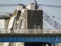 2017 February 18. Tokyo Japan. a man riding bicycle pass top part of Edokawa river water barrier control building on summer season
