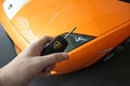 17 February 2011 Ukraine, Kiev. Man holds the key of Lamborghini Gallardo LP550-2 Valentino Balboni