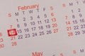 February 14, Valentines Day is marked in red on the calendar. Concept of romantic relationship and Valentine`s Day celebration Royalty Free Stock Photo