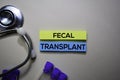 Fecal Transplant text on Sticky Notes. Top view isolated on office desk. Healthcare/Medical concept