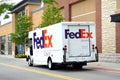 Fed Ex Ground truckstopped in front of business for a local delivery. Royalty Free Stock Photo