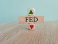 FED price symbol. A brick block with arrow symbolizing that Federal reserve index price are going down or up Royalty Free Stock Photo