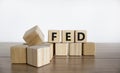 FED symbol. Wooden cubes with word `FED` on a beautiful wooden table, white background. Business and FED concept, copy space Royalty Free Stock Photo