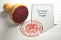 Federal funds rate decrease. Arrow with cut of federal fund rate and stamp of federal reserve FRS symbol Royalty Free Stock Photo
