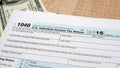 Federal income tax return 1040 documents for 2016 year with dollars Royalty Free Stock Photo