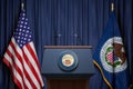 Federal Reserve System Fed of USA chairman press conference concept. Tribune with symbol and flag of FRS and United States Royalty Free Stock Photo