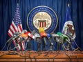 Federal Reserve System Fed of USA press conference concept. Microphones TV and radio channels with symbol and flag of US Federal Royalty Free Stock Photo