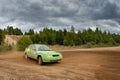 Fedor Kratov drives a green Lada Priora car