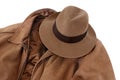 Brown leather jacket and fedora hat isolated on white background Royalty Free Stock Photo