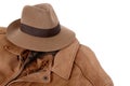 Old Fedora hat and brown leather jacket isolated on white background Royalty Free Stock Photo