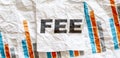 FEE word text on the white memo note crupled sticker on chart background Royalty Free Stock Photo