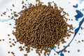The Feed for catfish at the end of the nursery stage and the beginning of the growing stage. Pile of compound feed small round