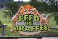 A Feed The Giraffes sign at Longleat Safari Park, Wiltshire, UK