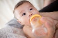 Feed milk to baby Royalty Free Stock Photo