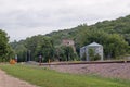 A Feed Mill and Grain Bins Along a Railroad Track