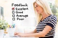 Feedback with happy young woman in front of the computer Royalty Free Stock Photo