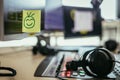 Feedback and motivation concept: Smiley Illustration at the working place, radio studio