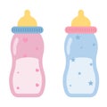 Feeding baby bottles for boy and girl in blue and pink Royalty Free Stock Photo