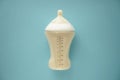 Feeding bottle of baby formula on color background Royalty Free Stock Photo