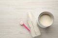 Feeding bottle with infant formula and powder on white wooden table, flat lay. Space for text Royalty Free Stock Photo