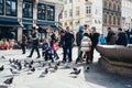 Feeding the doves at HÃÂ¸jbro Plads in Copenhagen