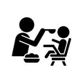 Feeding in highchair black glyph icon