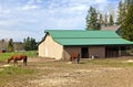 Feeding horses and barn in rural Oregon.