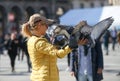 Feeding the pigeons in Milan square, Italy, 04 09 2017