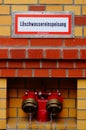 Feeding point of a riser for the fire brigade at a building. Royalty Free Stock Photo