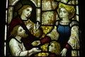 Feeding the poor (good deed) in stained glass