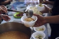 Feeding the poor to hands of a beggar. Poverty concept Royalty Free Stock Photo