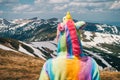 Feel freedom concept in mountains, woman traveling in a unicorn Royalty Free Stock Photo