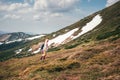 Feel freedom in mountains, woman traveling in unicorn costume Royalty Free Stock Photo