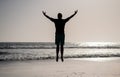 feel freedom. young and free. sport athlete jumping in the ocean. morning workout activity.